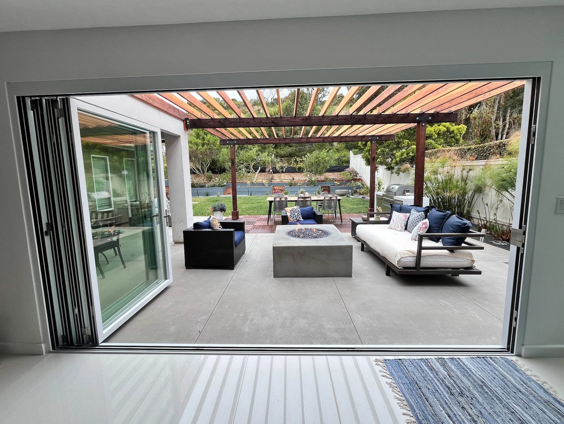 Flush, step-free threshold connecting the interior directly to a level outdoor patio
